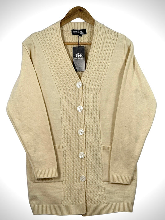 Cozy&Drape cream long cardigan sweater with a cable knit front panel, button closure, and two front pockets.