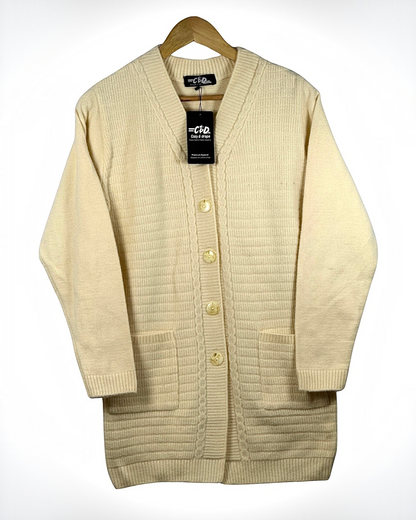 Cozy&Drape cream long cardigan sweater with a button-up front, ribbed texture, and two convenient front pockets.