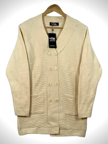 Cozy&Drape cream long cardigan sweater with a textured wave pattern, v-neck, front buttons, and two patch pockets.
