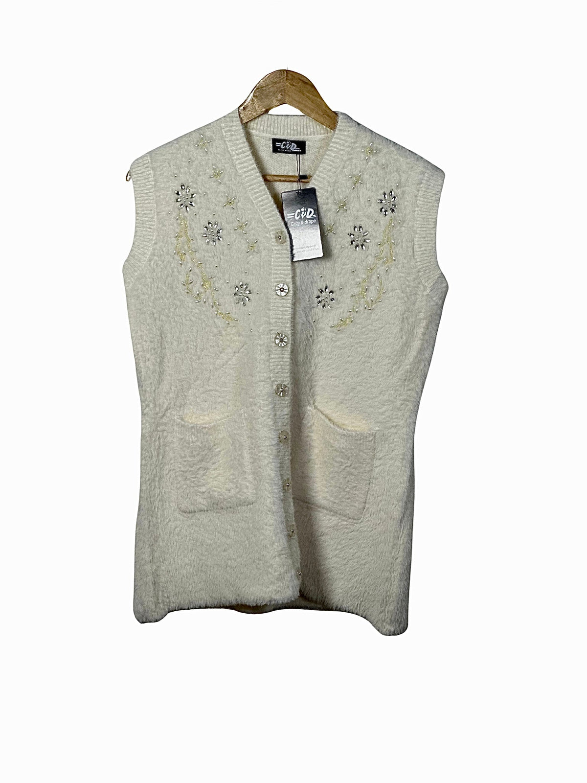 Cozy&Drape cream sleeveless cardigan sweater with floral bead embroidery, button front, and two front pockets.