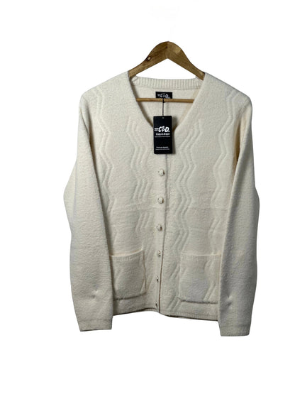 Cozy&Drape cream full-sleeve cardigan sweater with front pockets and textured wave pattern on a wooden hanger