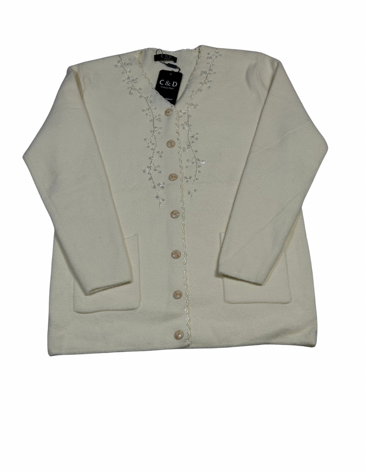 Cozy&Drape cream wool cardigan with front buttons, pockets, and delicate floral bead embroidery on the neckline.