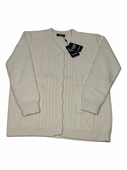 Cozy&Drape cream wool cable knit cardigan with button front, long sleeves, and two pockets.