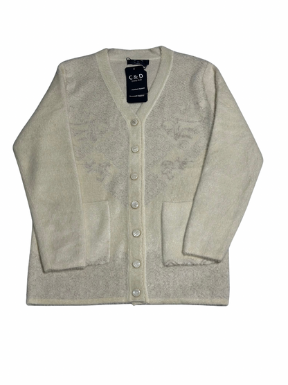 Cozy&Drape cream wool cardigan sweater with front pockets, long sleeves, and button-up front closure.