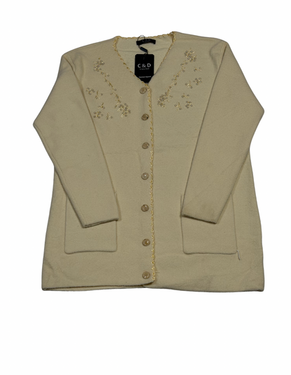 Cozy&Drape cream wool cardigan sweater featuring front buttons, pockets, and delicate floral beadwork embroidery.