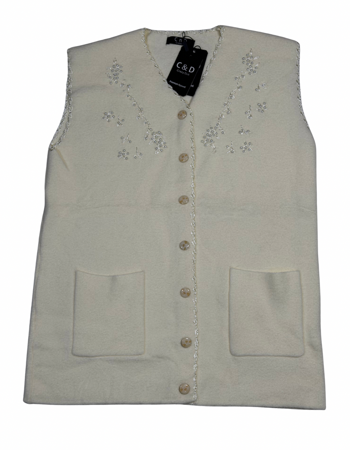 Cozy&Drape sleeveless wool cardigan in cream with floral bead embroidery, front buttons, and two patch pockets.