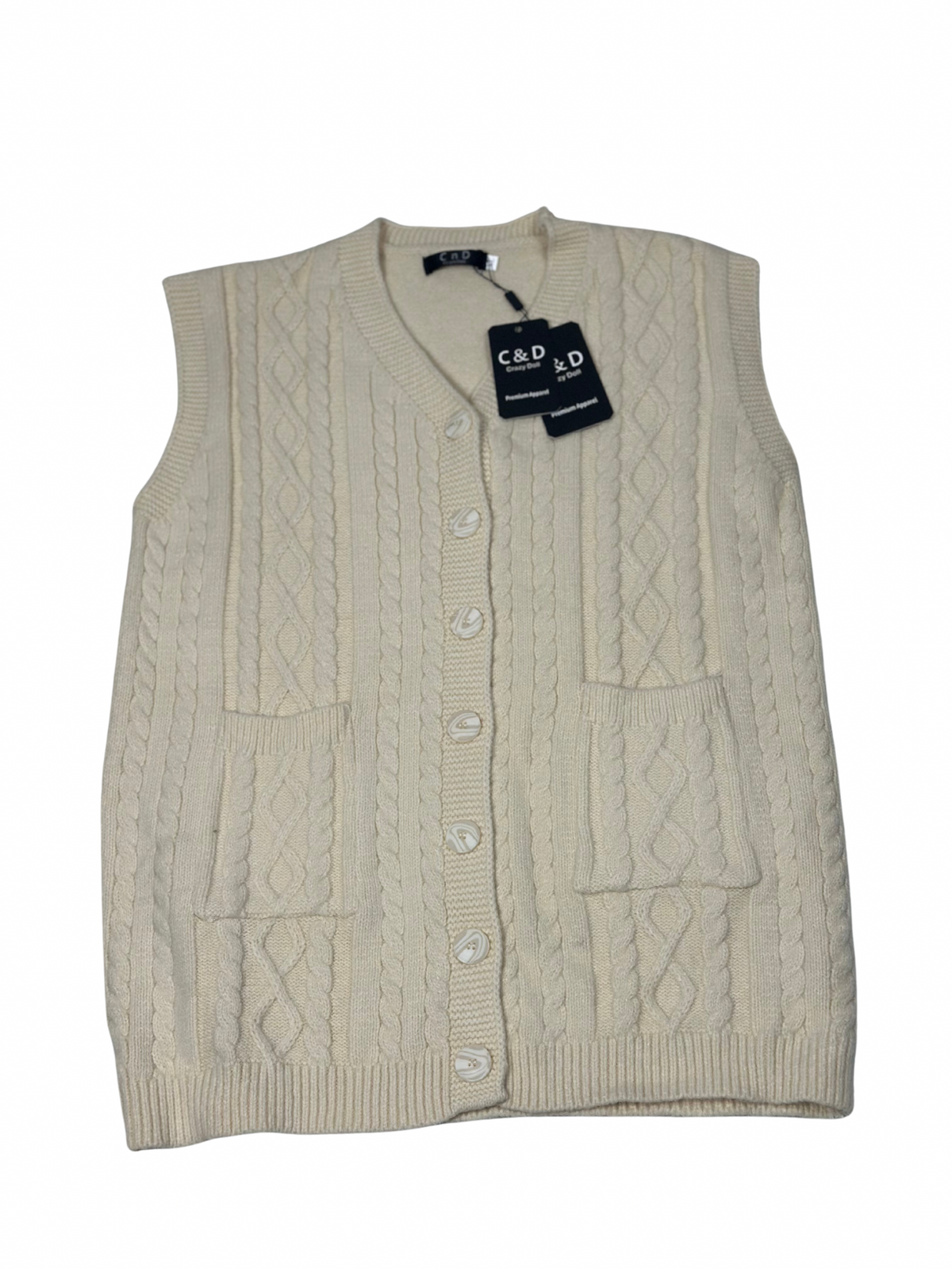 Cozy&Drape cream wool sleeveless cardigan sweater with cable knit texture, front buttons, and two patch pockets.