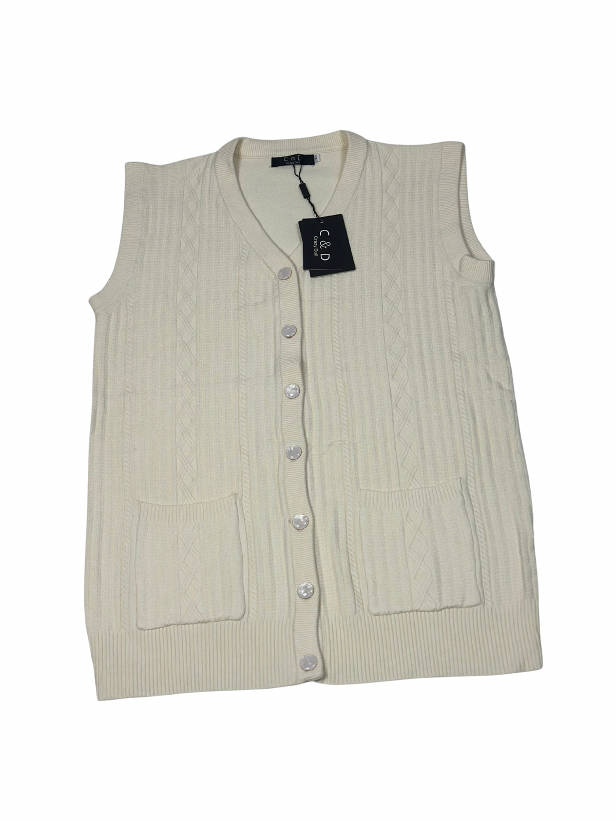 Cozy&Drape sleeveless wool cardigan sweater in cream with cable knit texture, front buttons, and two patch pockets.