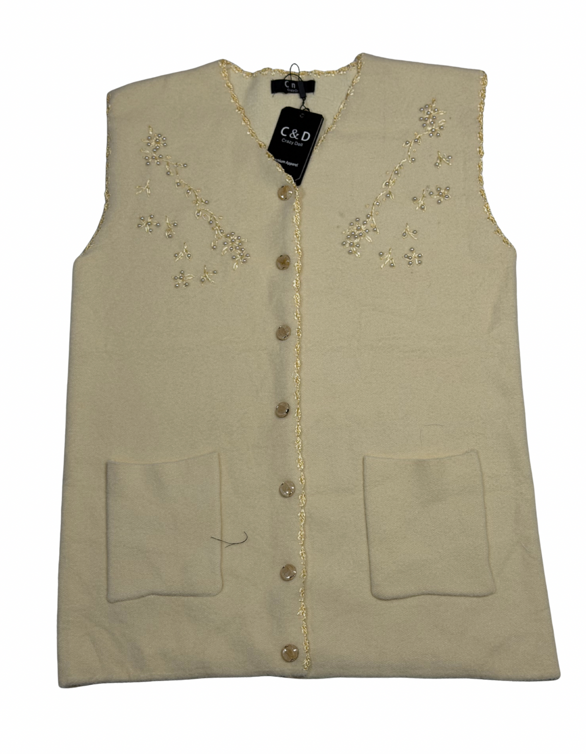 Cozy&Drape sleeveless wool cardigan in cream with floral embroidery, front buttons, and two patch pockets.