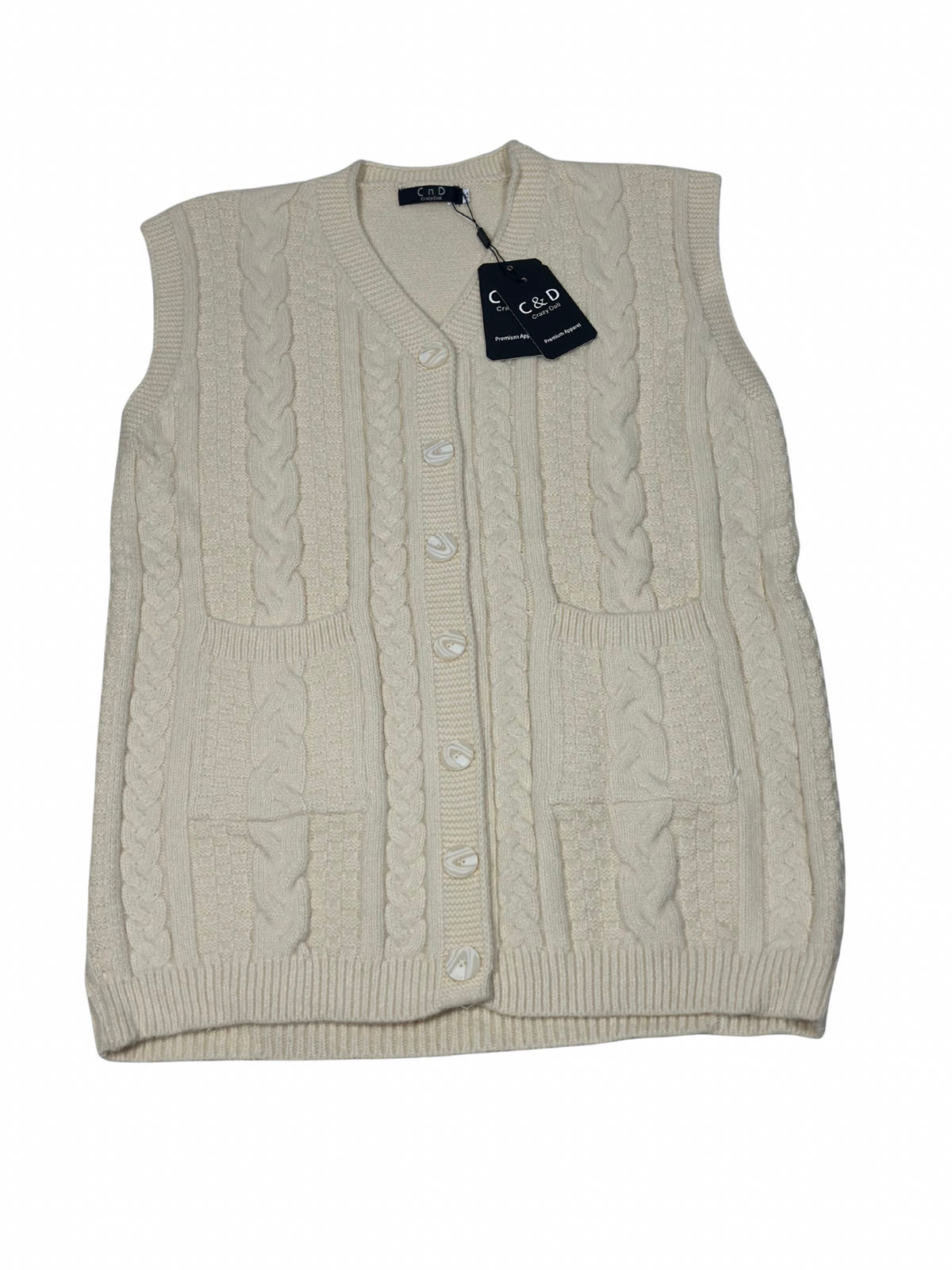 Cozy&Drape cream wool sleeveless cardigan sweater with cable knit texture, front buttons, and two patch pockets.