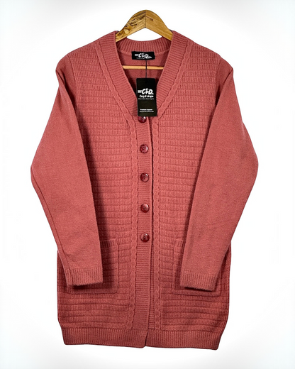 Cozy&Drape long button-down cardigan sweater in dusty rose with ribbed texture and front pockets on a wooden hanger