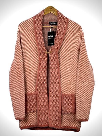 Cozy&Drape open front sweater in dusty pink with chevron pattern, textured trim, and two front pockets on a hanger.