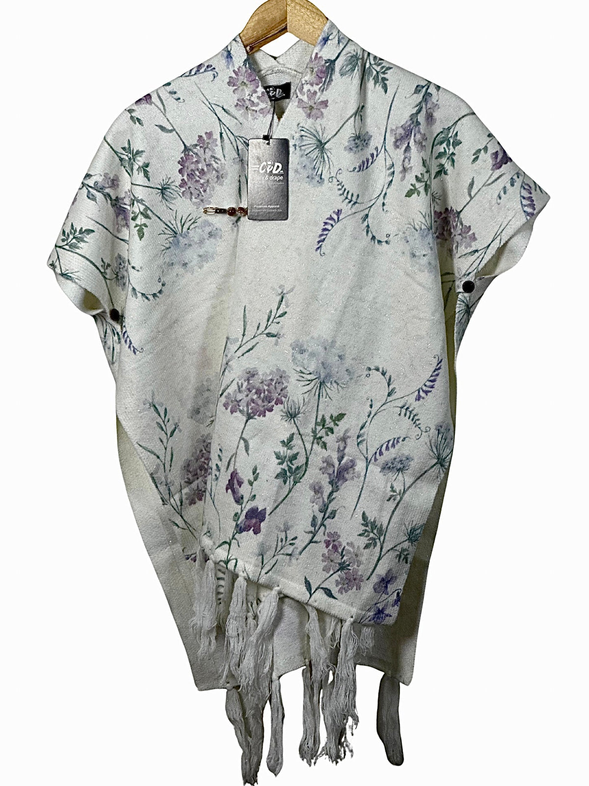 Cozy&Drape floral print winter cape shawl in cream with purple and green botanical patterns and fringe hem detail
