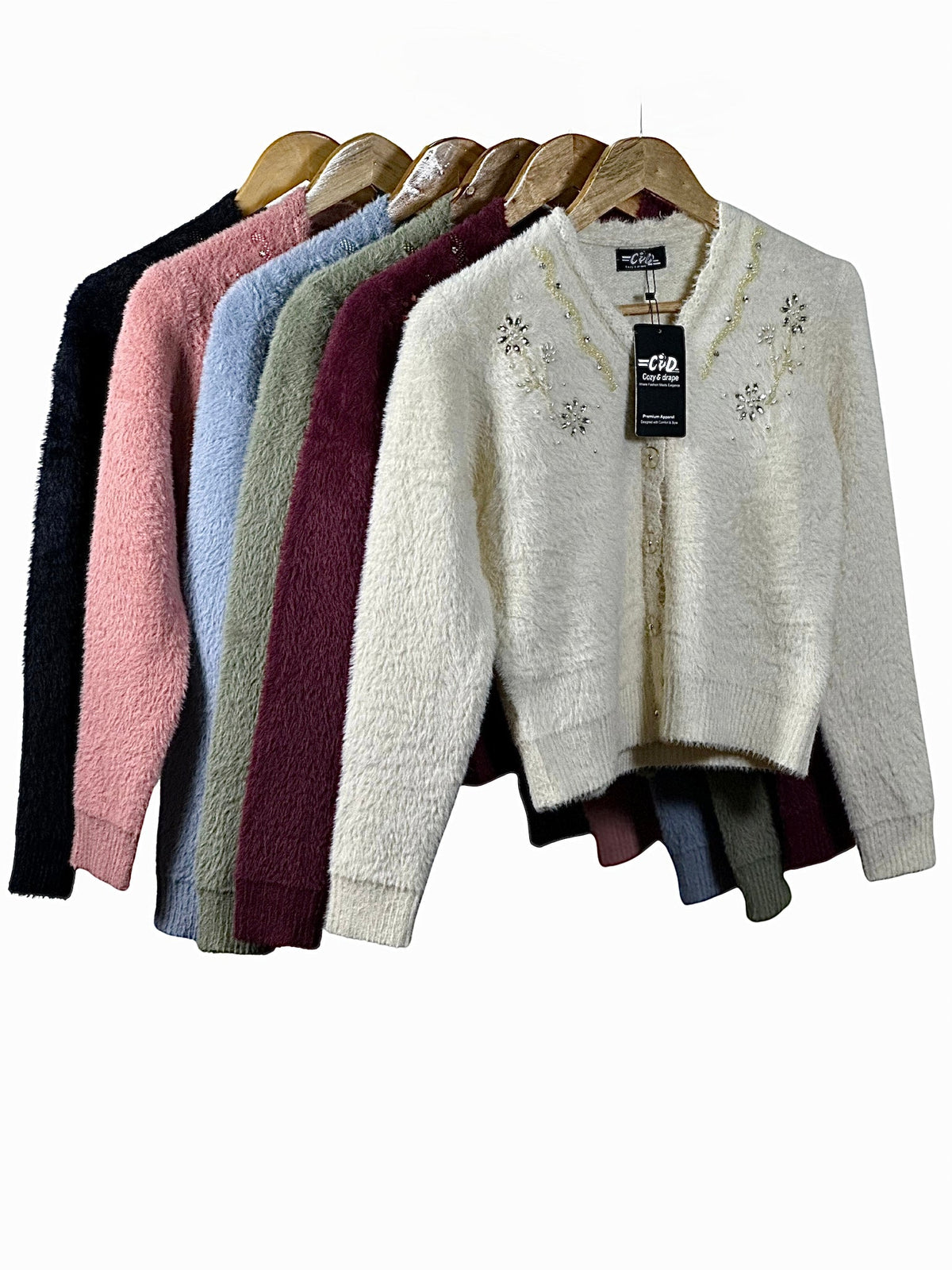 Cozy&Drape extra short fuzzy cardigan sweaters in various colors with beaded floral embellishments on hangers