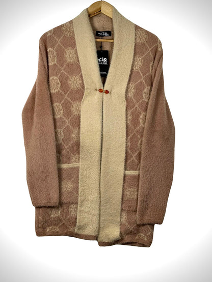 Cozy&Drape open front sweater in dusty rose and cream with a geometric pattern, front pockets, and toggle closure.