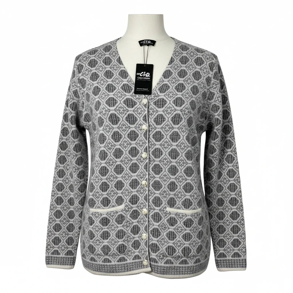 Cozy&Drape grey and white geometric patterned V-neck cardigan with front buttons and pockets on a mannequin