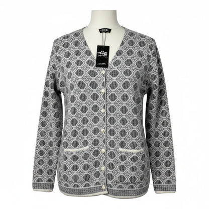 Cozy&Drape grey and white geometric patterned V-neck cardigan with front buttons and pockets on a mannequin