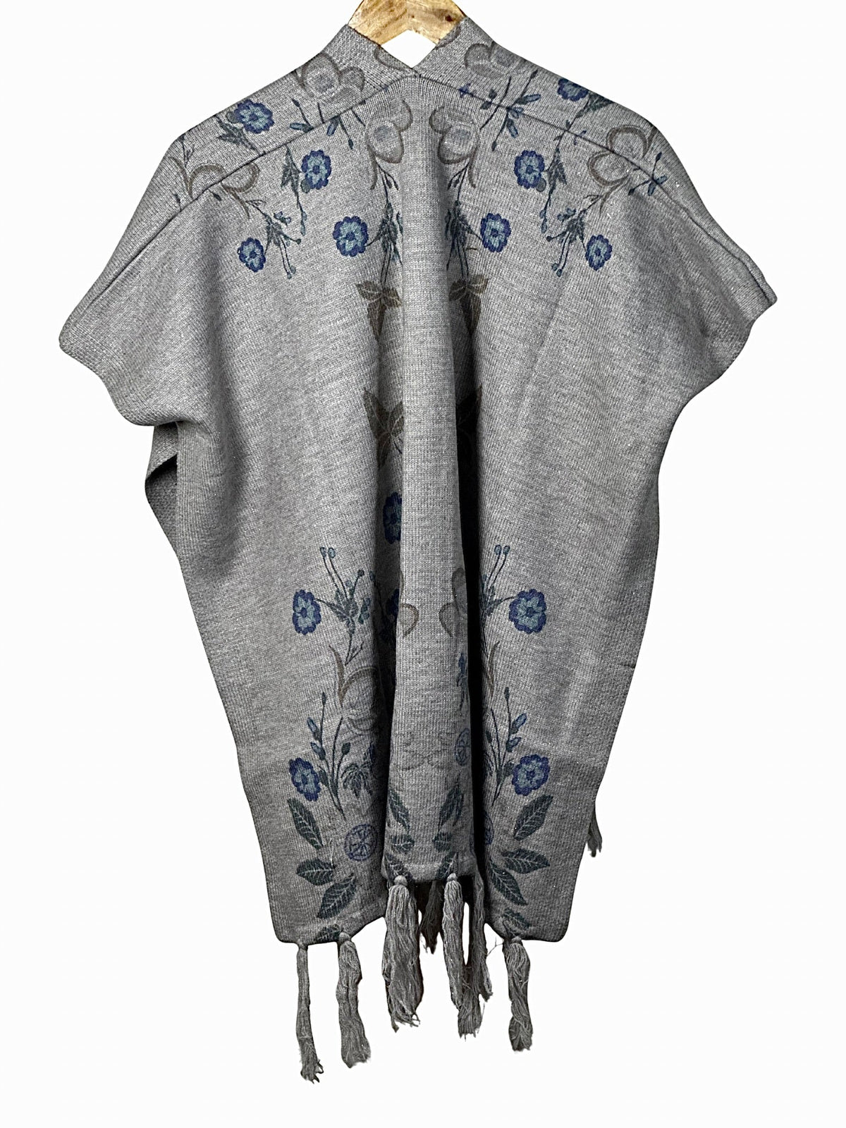 Cozy&Drape grey winter cape shawl featuring elegant blue floral embroidery and decorative tassel hem details.