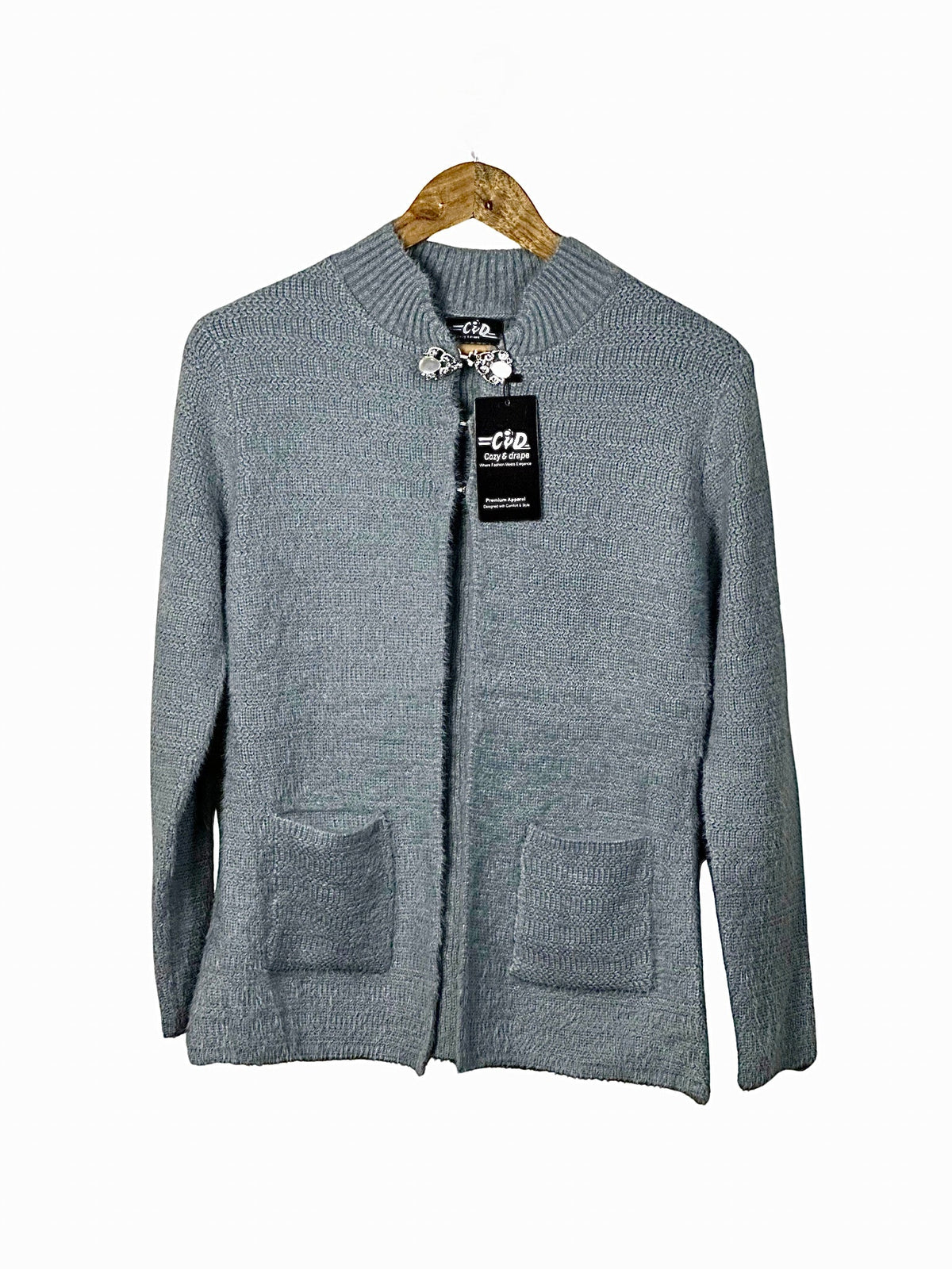 Cozy&Drape grey open front cardigan sweater with long sleeves and two front pockets on a wooden hanger