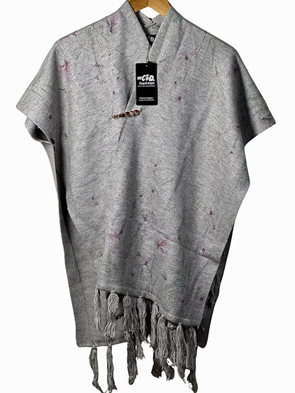 Cozy&Drape grey winter cape shawl with subtle purple floral accents, featuring a decorative brooch and fringe hem.