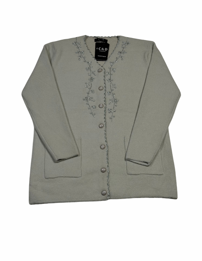 Cozy&Drape wool cardigan in light grey with front button closure, pockets, and delicate silver floral embroidery.