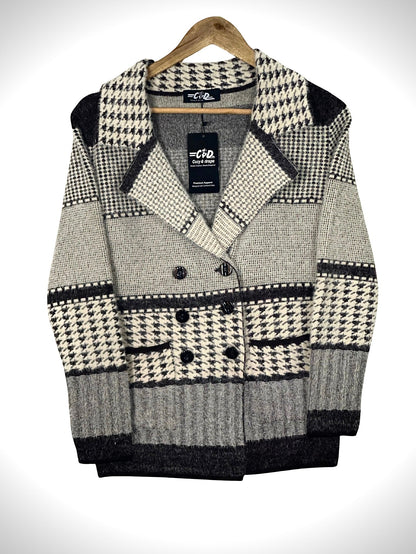 Cozy&Drape short cardigan sweater coat in a black and white houndstooth pattern with double-breasted button closure.