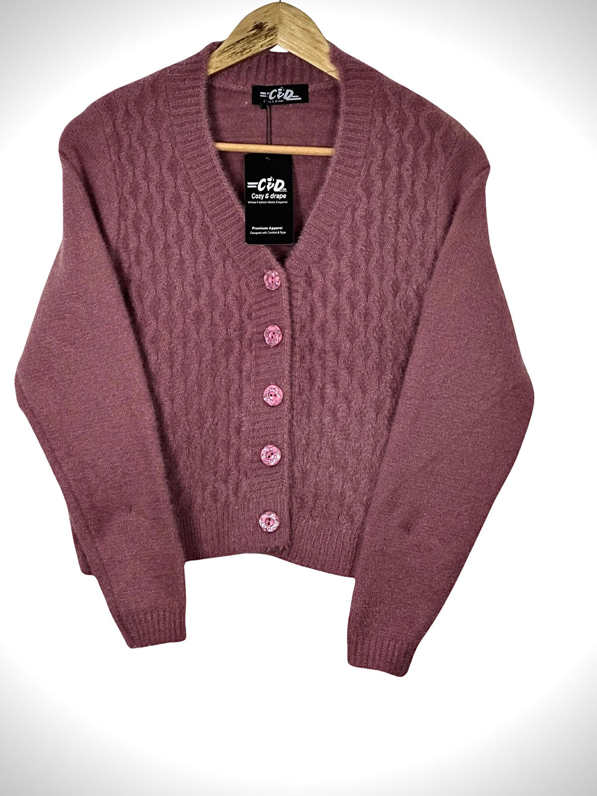 Cozy&Drape extra short mauve cardigan sweater with cable knit texture and matching buttons on a wooden hanger