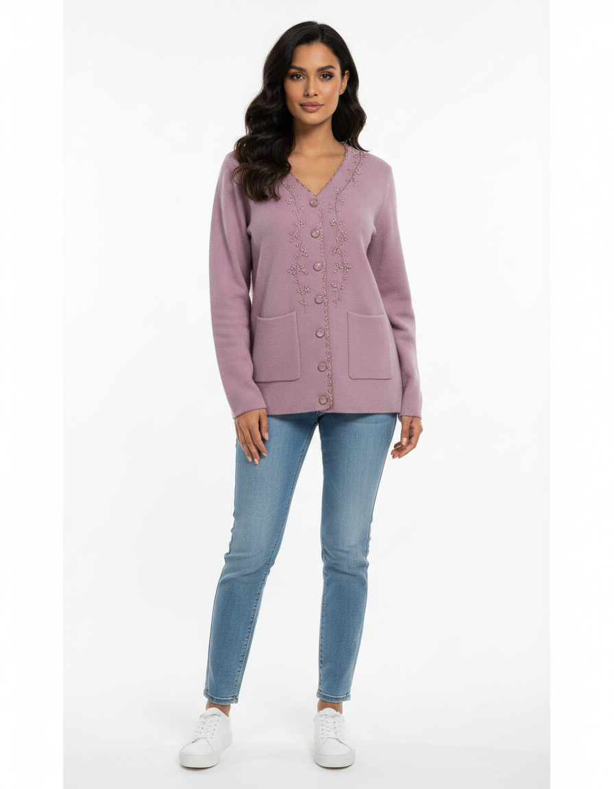 Cozy&Drape mauve V-neck knit cardigan with floral embroidery, button front, and pockets worn with blue jeans.