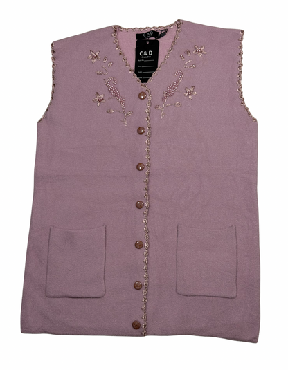 Cozy&Drape sleeveless wool cardigan in mauve with floral embroidery, button front, and two front pockets.