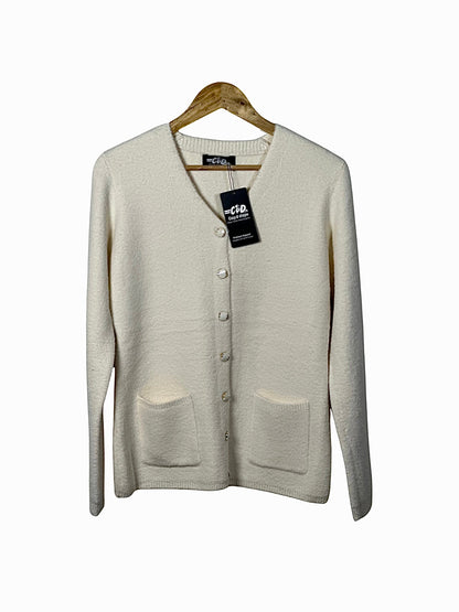 Cozy&Drape cream full sleeve cardigan sweater with front pockets and button-down closure on a wooden hanger