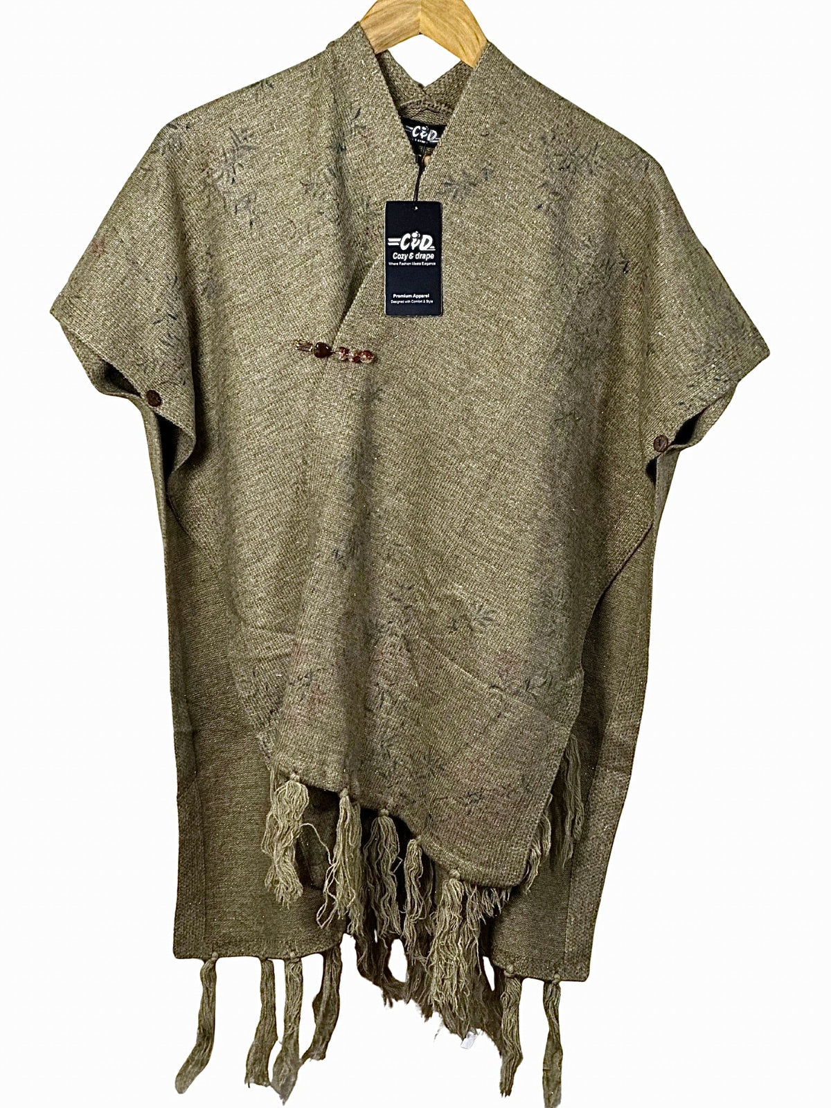 Cozy&Drape cape shawl in olive green with textured fabric, button closure, and decorative fringe hem for winter.