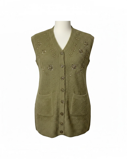 Cozy&Drape olive green sleeveless knit cardigan with V-neck, floral embroidery, beadwork, and front pockets.