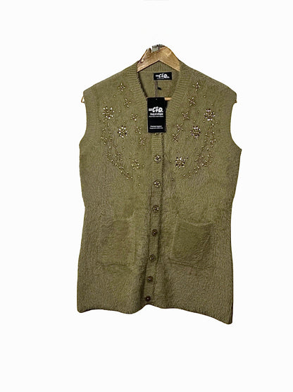 Cozy&Drape olive green sleeveless cardigan sweater with floral beadwork embroidery and front pockets on a hanger
