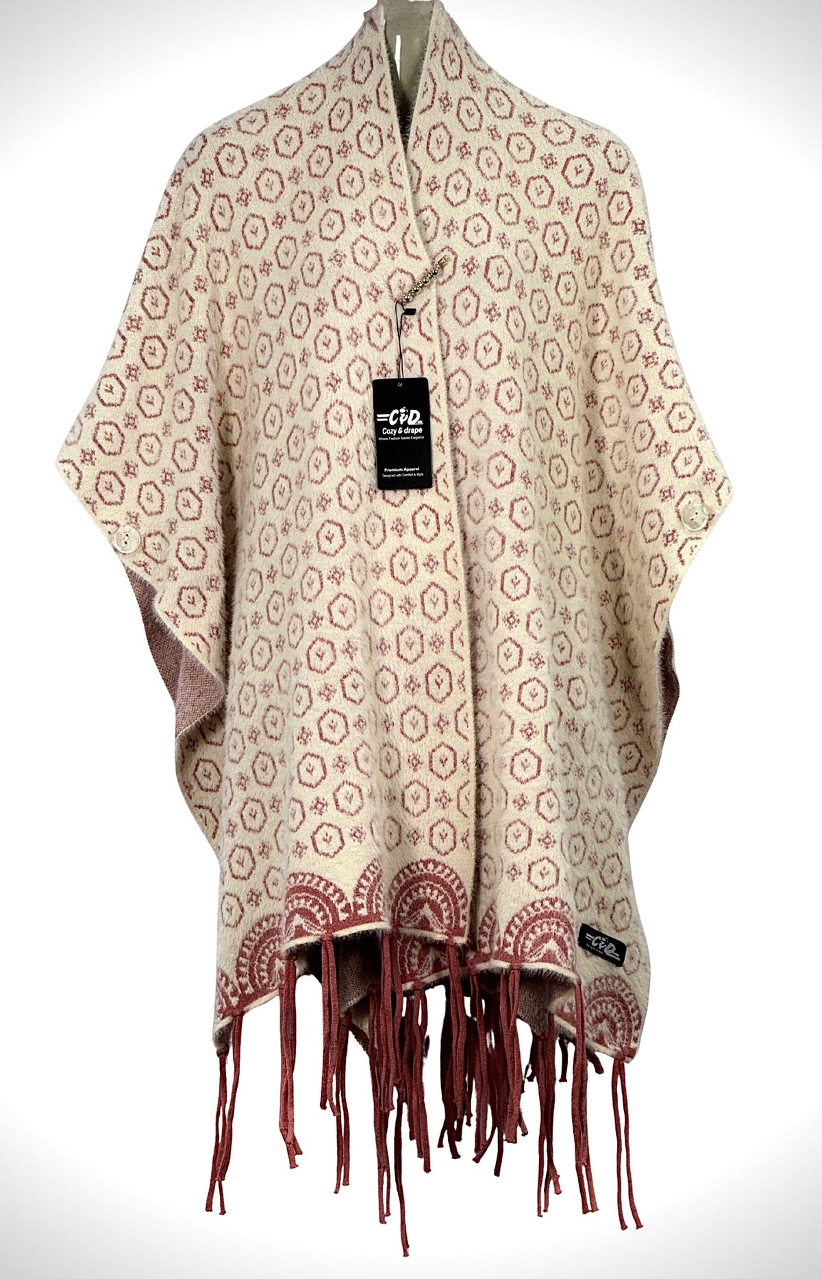 Cozy&Drape beige and maroon patterned winter cape shawl with fringe hem and button details on a mannequin