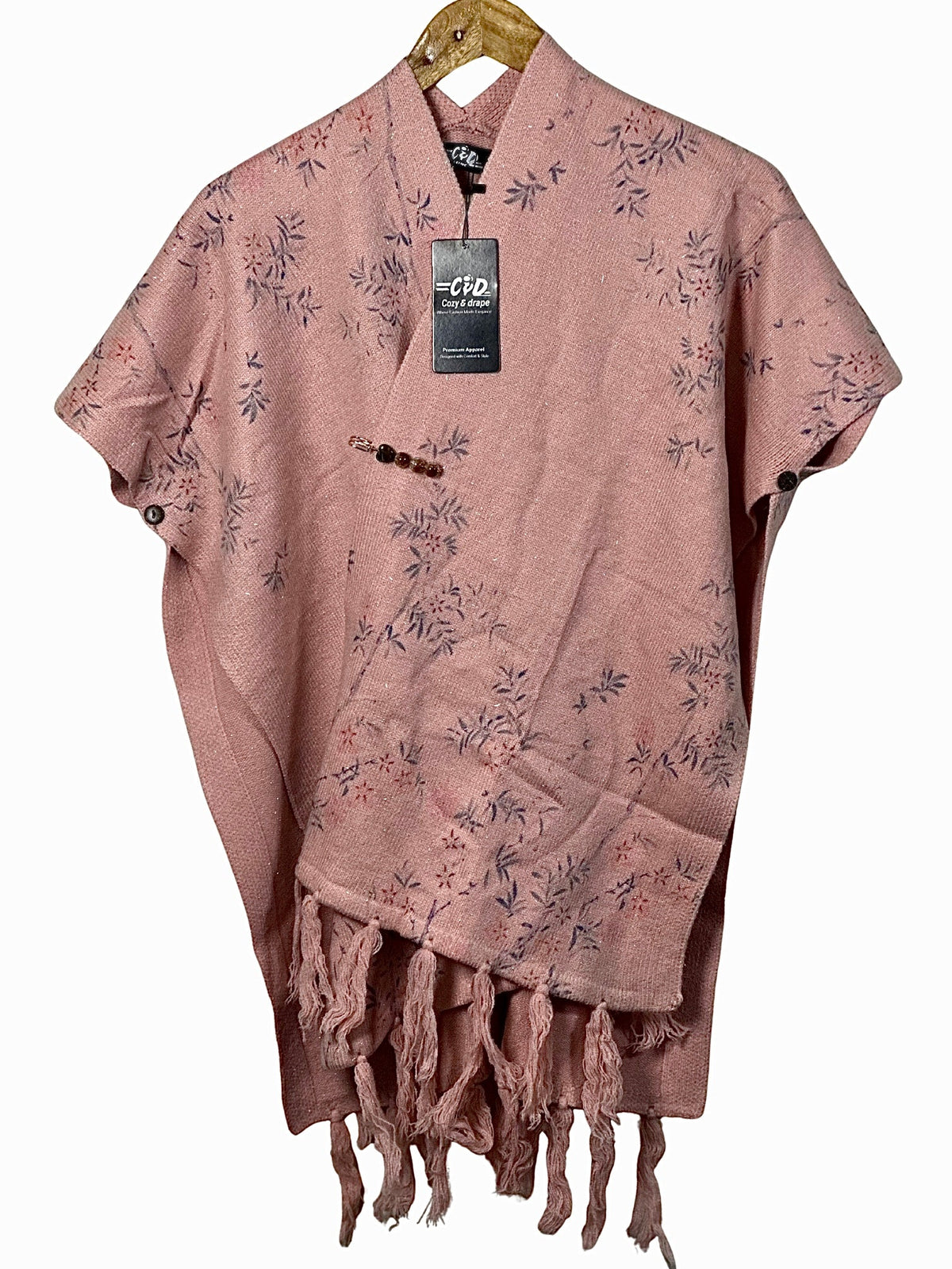 Cozy&Drape pink floral cape shawl with fringe hem and side button details for winter warmth.