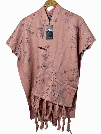 Cozy&Drape pink floral cape shawl with fringe hem and side button details for winter warmth.