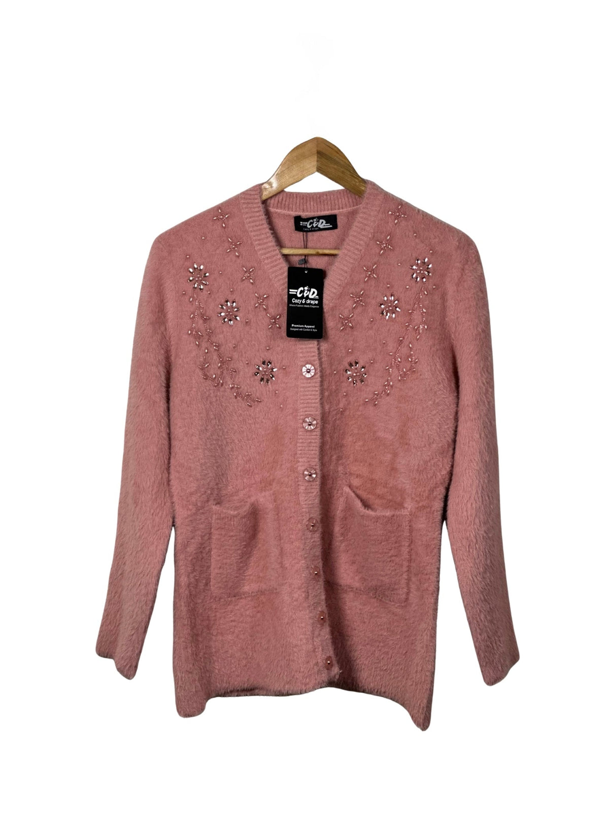 Cozy&Drape pink fuzzy cardigan sweater with floral bead embellishments, long sleeves, and front pockets on a hanger.