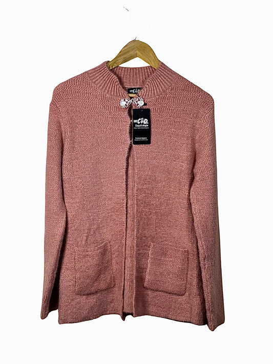 Cozy&Drape pink long-sleeve open cardigan sweater with front pockets and ribbed collar on a wooden hanger
