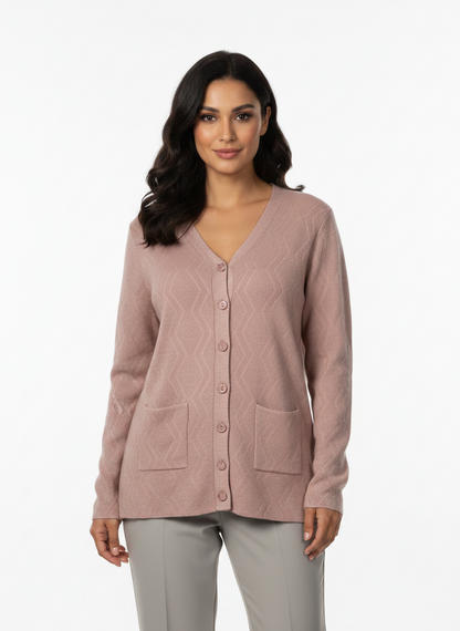 Model wearing a Cozy&Drape dusty pink V-neck knit cardigan with a button-front closure and two front pockets.