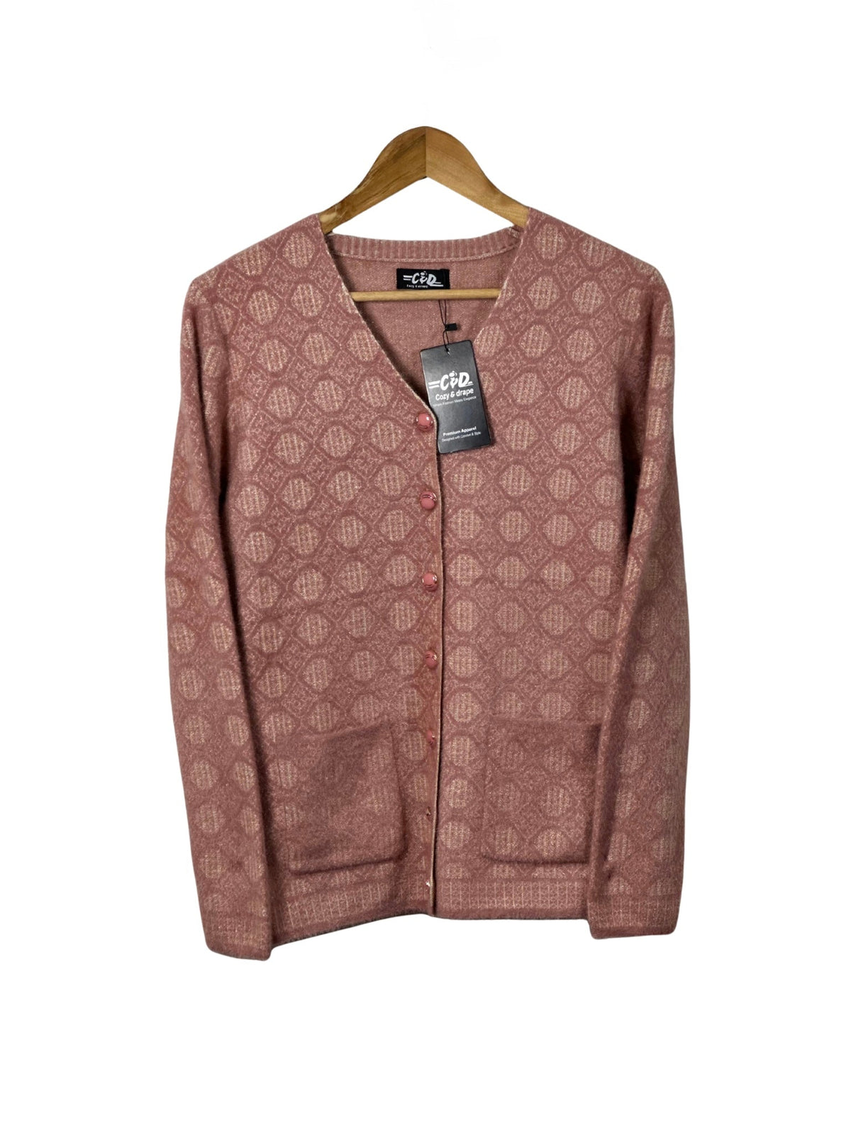 Cozy&Drape dusty rose full sleeve cardigan sweater with a geometric pattern, V-neck, and front pockets on a hanger.