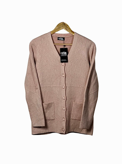 Cozy&Drape blush pink wool cardigan sweater with long sleeves, button front, and two patch pockets on a hanger.