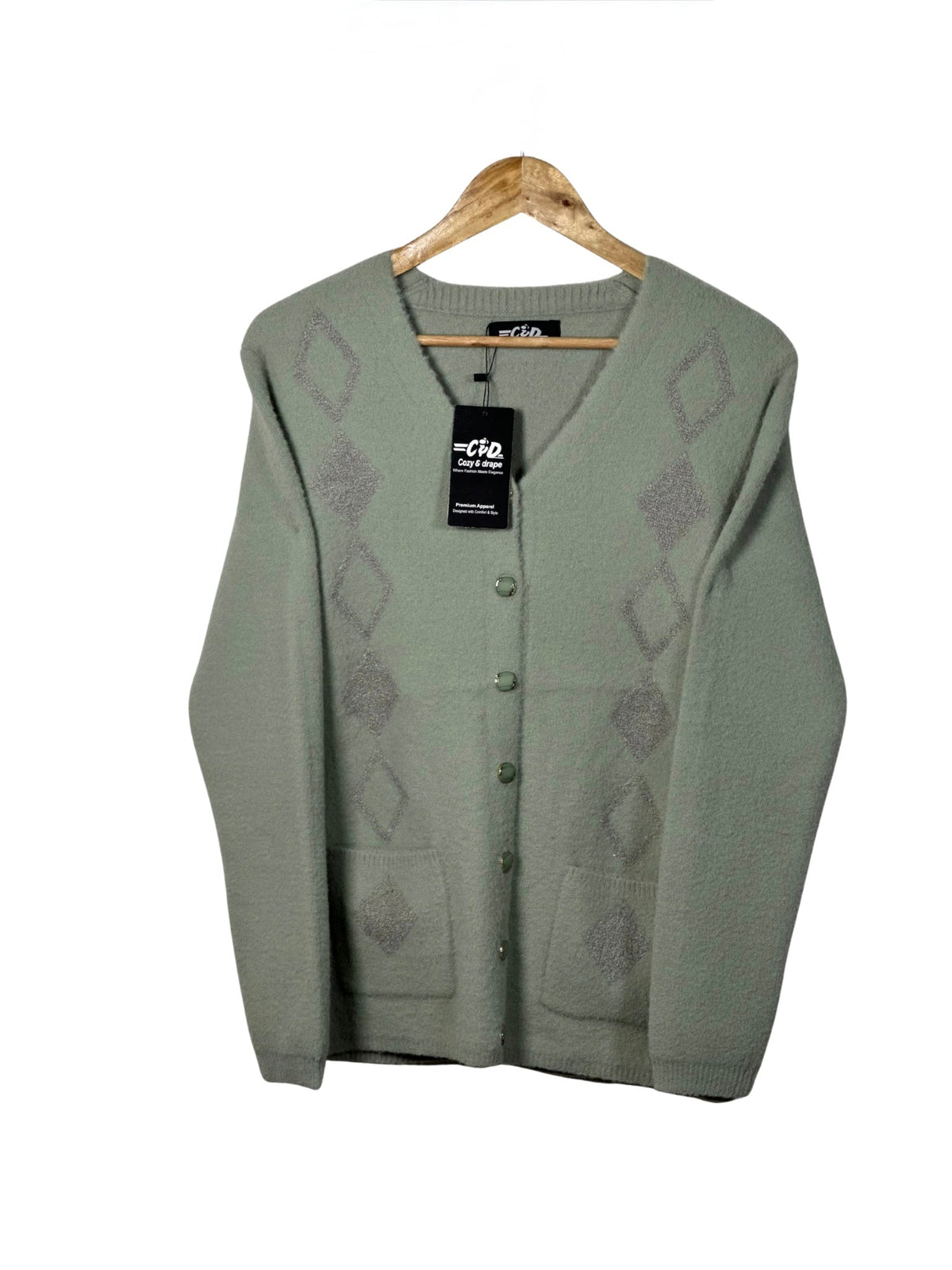 Cozy&Drape sage green full sleeve cardigan sweater with diamond pattern, front buttons, and two pockets on a hanger