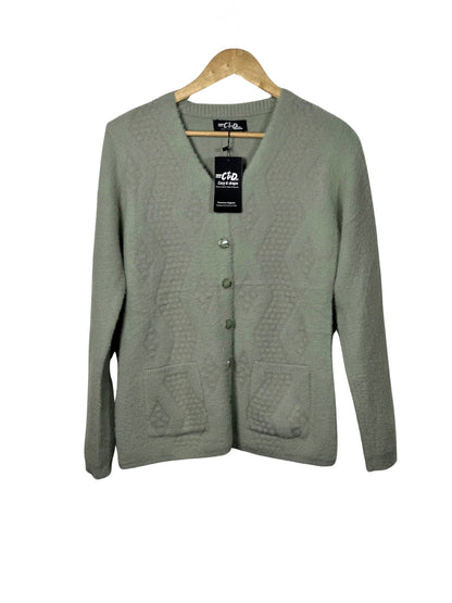Cozy&Drape sage green full sleeve cardigan sweater with front pockets and textured knit pattern on a wooden hanger