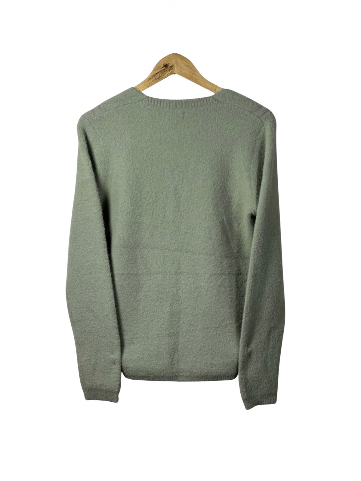 Cozy&Drape sage green long sleeve cardigan sweater with a soft textured knit finish hanging on a wooden hanger