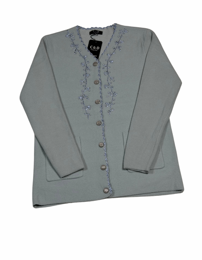 Cozy&Drape sage green wool cardigan with delicate floral embroidery, button-front closure, and two front pockets.