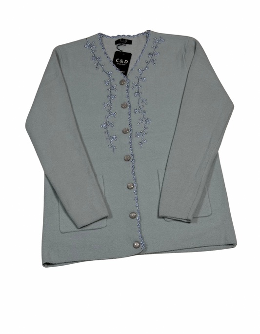 Cozy&Drape sage green wool cardigan with delicate floral embroidery, button-front closure, and two front pockets.