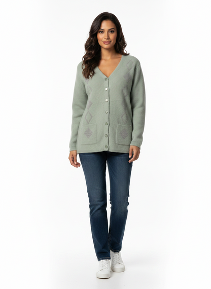 Model wearing a sage green Cozy&Drape button-up knit cardigan with diamond patterns, front pockets, and V-neckline.