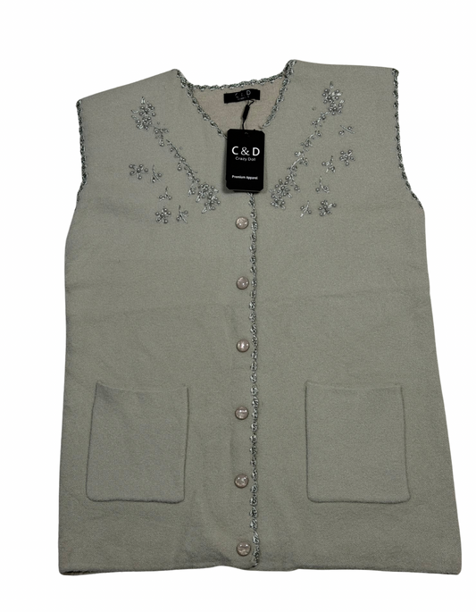 Cozy&Drape sleeveless wool cardigan in sage green with front pockets and delicate floral beadwork embroidery