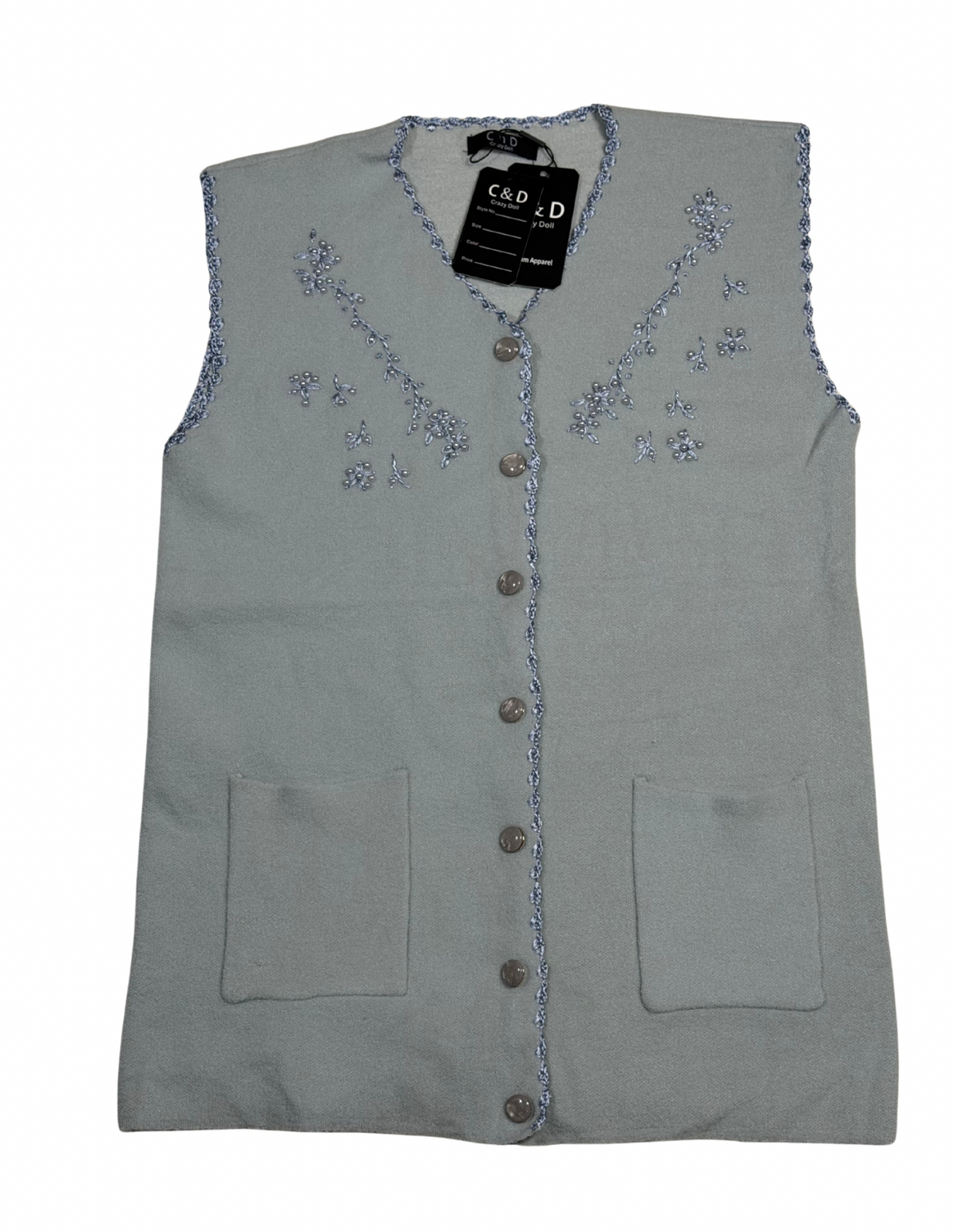 Cozy&Drape sleeveless wool cardigan in light grey with floral embroidery, front buttons, and two patch pockets.