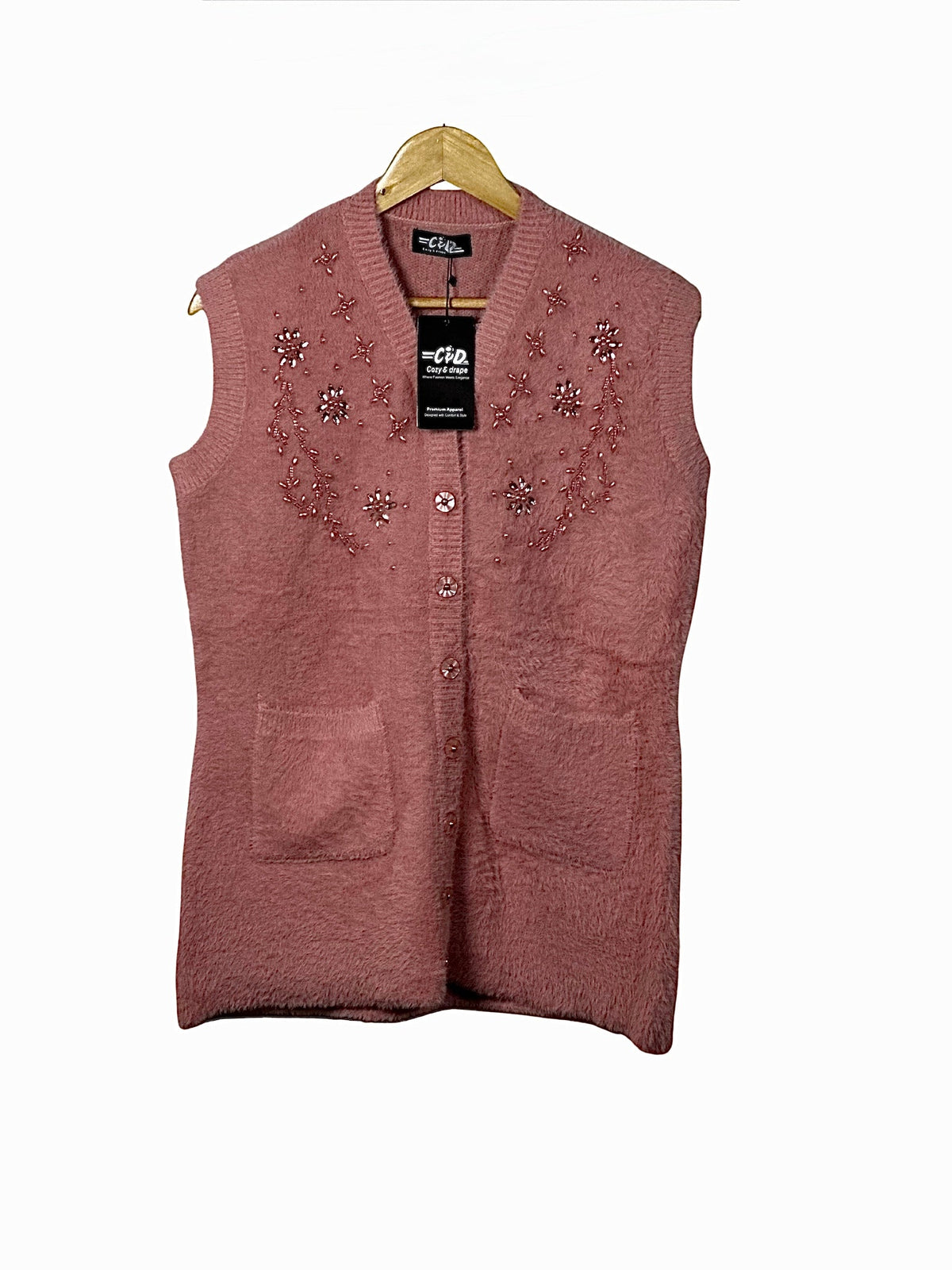 Cozy&Drape sleeveless cardigan sweater in dusty rose with floral beadwork, front buttons, and two patch pockets.